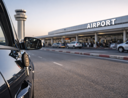 Car rental pickup at Beirut airport with vehicle keys and terminal in the background, showing what to expect when driving from the airport in Lebanon