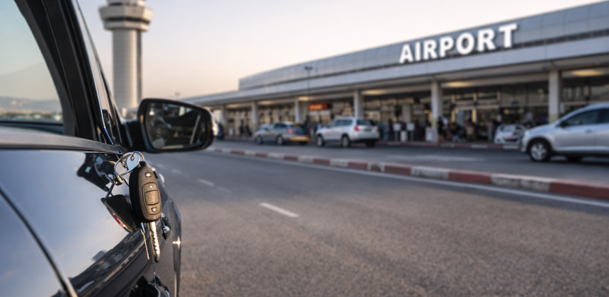 Car rental pickup at Beirut airport with vehicle keys and terminal in the background, showing what to expect when driving from the airport in Lebanon